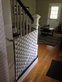 the stairs are decorated with white and black geometric tiles