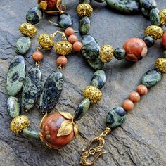 New to our Gemstone Echoes collection: Art Nouveau Agate & Kambaba Jasper Necklace Set Amazingly large rounds of upcycled orange agate and swirling greens of kambaba jasper are accompanied by a mix of vintage and new brass. The nature theme of leaves and flowers continues in the decorative clasp -- a beautiful chunky statement jewelry set with unusual stones. The stones in this set are nothing short of gorgeous. You'll love wearing this conversation piece with your favorite little black dress or Jewelry Chunky, Kambaba Jasper, Orange Agate, Jasper Necklace, Natural Stone Jewelry, Upcycled Jewelry, Agate Necklace, Hand Jewelry, Chunky Necklace