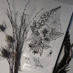 some flowers and plants are on display in a glass case with the words wild garden