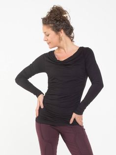 Ruched side panels create a flattering silhouette on one of our best selling long sleeve tops. It features a slightly draped neckline and hit just below the waist. [#details] Size Suggestions S: 2-4 M: 6-8 L: 10-12 [/details] [#fabric] Rayon Lycra: 90% Rayon (Viscose) / 10% Spandex (Lycra) [/fabric] Fitted Tops With Ruched Sides For Fall, Ruched Tops For Layering In Fall, Fall Ruched Tops For Layering, Ruched Fitted Long Sleeve Top For Fall, Ruched Long Sleeve Top For Fall, Fitted Foldover Long Sleeve Top For Fall, Stretch Ruched Tops For Fall, Fitted Long Sleeve Foldover Top For Fall, Fitted Long Sleeve Top With Ruched Sides