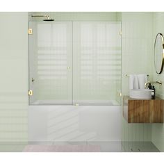 a bathroom with a sink, mirror and bathtub next to a shower stall in the corner