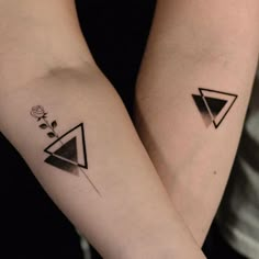 two people with matching tattoos on their arms