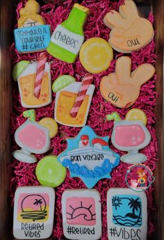 decorated cookies in a wooden box on display