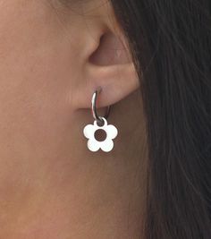 Earring size: 1.1'' x 0.6'' or 27mm x 15.2mm Hoop size: 16mm Flower size: 15.2mm Description: Simple and minimal daisy flower hoop earrings in gold or silver plated stainless steel. Stainless steel is waterproof and hypoallergenic which means it is less likely to cause allergic reactions in people with sensitive skin. So wear it in water and enjoy! All items come shipped in a protective jewelry box. Check out my shop for more items: https://www.etsy.com/shop/TenthRealmJewelry Message me with any questions or concerns you may have, I'll respond instantly! Thank you for checking out my shop, enjoy! :) Everyday Flower Charm Hoop Earrings, Dainty Hoop Earrings With Flower Charm, Everyday Flower Hoop Earrings, Everyday Flower Shaped Hoop Earrings, Minimalist Nickel Free Flower Earrings For Everyday Wear, Small Hoop Jewelry With Flower Charm For Everyday, Everyday Small Hoop Jewelry With Flower Charm, White Hoop Earrings With Flower Charm, Minimalist Sterling Silver Flower Charm Earrings