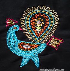 an embroidered peacock with beads on it's tail