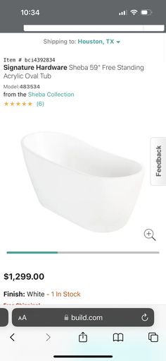 a white bath tub sitting on top of a table