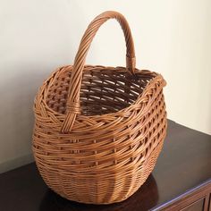 A real beauty, this rustic mid-20th century market basket features intricate handwoven designs, a braided rim, and French randing at the bottom. It is a sturdy, tall, and deep basket, making it perfect for carrying larger fruits and vegetables, as well as wine and other bottles. Also doubles as a lovely display piece.  Basket interior measures roughly 15” (w) x 9”(d) x 10” (h). Basket Making, Market Basket, Vintage Baskets, Market Baskets, Stylish Storage Solutions, Old Farmhouse, Slow Living, Real Beauty, Accessory Organization