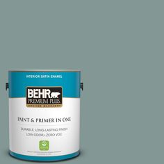 a can of behr paint on a gray background