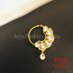 Kundan CZ non piercing nose ring Nosepin/Bridal nosering/Indian Wedding Jewelry/Bridal NoseClip/ Nose Ring/Indian Nath Faux Nose Ring,Bollywood Nose Ring, Traditional Nath, Sabyasachi Indian nose pinAvailable in pretty colorsFeaturesTraditional Handwork Kundan Nose pinHandcrafted To Perfection,Light Weight Nose PinHandmade JewelryLength: 1 InchesClip Feature Nose PinPerfect for any Indian Wedding and Bridal attireMade in Brass with very high quality Kundan and CZ stones Tilla Nose Rings For Wedding Festivities, Festive Wedding Nose Ring With Tilla, Chandbali Nose Rings For Wedding And Festivals, Festive Chandbali Nose Ring For Weddings, Wedding Chandbali Nose Ring, Gold Nose Studs For Wedding, Kundan Temple Jewelry Nose Rings For Gift, Traditional Kundan Nose Rings As Gift, Bollywood Chandbali Nose Rings For Gift