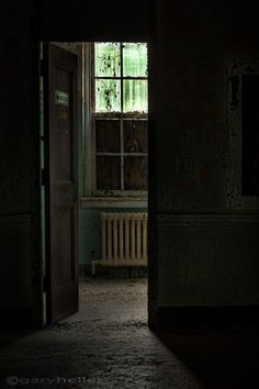 an open door leading into a dark room