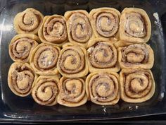 cinnamon rolls in a glass baking dish ready to be baked into the oven for dinner