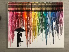 a person holding an umbrella in front of a rainbow colored background with crayons