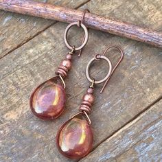 "Bronze luster Czech glass teardrops and antiqued copper accent earrings. Bronze luster Czech glass teardrops with a beautiful Picasso finish complimented by antiqued copper. Light-weight and versatile, a perfect gift idea or a great addition to add a bit of rustic, earthy color to your collection! Product overview: - Made with Czech glass teardrops and antiqued copper - Light-weight, approximately 1.75\" in total hanging length - Hypoallergenic ear wires To view my other handcrafted jewelry, pl 2022 Earrings, Cuffs Diy, Genuine Turquoise Jewelry, Accent Earrings, Gold Teardrop Earrings, Earthy Earrings, Earrings Bronze, Copper Light, Copper Work