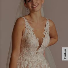 a woman in a wedding dress smiling at the camera