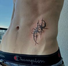 a man with a cross tattoo on his stomach