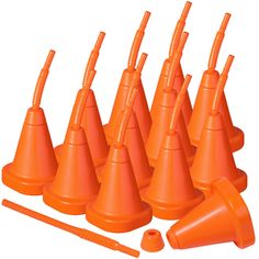 there are many orange cones with straws on them