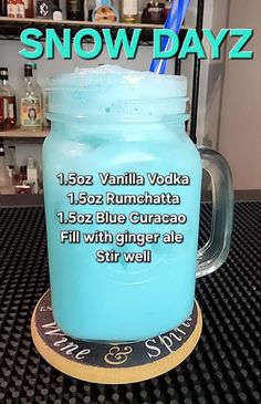 a blue mason jar sitting on top of a table