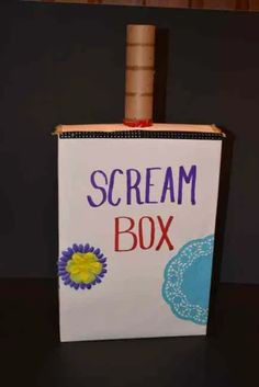 a box that has a small bottle in it with the words scream box written on it