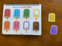 the match the colors book is open to show different pops and ice creams on it