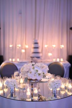 a table with candles and flowers on it