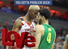 two men standing next to each other in front of a love sign with the words you gota problem duck