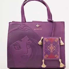 My Purse Is Basically New Was A Gift And I Really Don’t Use These Kind Of Bags It Has Not Been Used At All.. This Stunning Plum Purse Is Befitting For The Dark Hues Of Fall. It Features An Embossed Illustration Of Princess Jasmine, Along With A Jasmine Gold Genie Lamp Brand Logo. Also, A Nice Large Pin! If It Wasn’t For Aladdin’s Magic Carpet, Jasmine Would Forever Be Tucked Away In Her Turret, Locked Away From The Many Treasures And Charms Of The Abyss, And Thus, This Purse Features A Magic Car Disney Bags And Purses, Disney Bags For Daily Use, Daily Disney Style Bag, Disney Rectangular Bags For Disney Fan Events, Disney Rectangular Shoulder Bag For Daily Use, Disney Satchel Bag For Everyday Use, Disney Style Gift Bag, Rectangular Shape, Disney Style Shoulder Bag For Travel, Disney Rectangular Shoulder Bag For Everyday Use