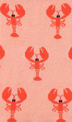 a red lobster pattern on a pink background