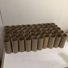 several rolls of toilet paper lined up on top of each other in the shape of a rectangle