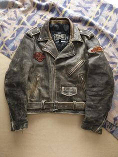 Listing: Vintage 1980s Harley-Davidson Faded Black Leather Jacket Biker XL First Genuine Size on Tag: XL Flaws: Some wear around the collar Measurements: Please see the photos in the listing. If you require additional measurements or information about this item, feel free to send a message. Biker Gang Jacket, Leather Jacket Biker, Harley Davidson Leather Jackets, Harley Davidson Vintage, Designer Leather Jackets, Biker Jacket Men, Biker Leather Jacket, Harley Davidson Jacket, Leather Biker Jacket