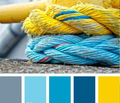 a yellow and blue color scheme with some rope on top of each other in the middle