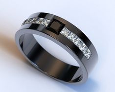 a black ring with white diamonds on it