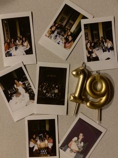 several polaroid photos are arranged on a table with a gold number 10 pin in the middle