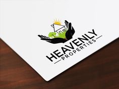 the logo for heavenly properties is shown on top of a white card with black lettering