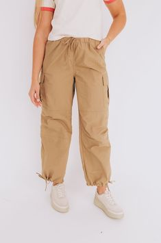 Introducing our Locked In Cargo Pants! With cargo pockets for all your essentials, an elastic waistband for ultimate comfort, and drawstring bottoms for a customizable fit. Stay stylish and functional with these pants. (What more could you want?!) Details Cargo pockets Elastic waistband Drawstring bottoms Sizing Approximate measurements: SIZE LENGTH/INSEAM WAIST Small 40/11"﻿ 30"﻿ Medium 41/12"﻿ 32"﻿ Large 41/12"﻿ 34"﻿ Fabric has no stretchModel is 5’9 wearing small Material 100% NylonHand wash Cargo Pants Sale, Cargo Pants, Lay Flat, Apparel Accessories, Elastic, Pants, Fabric, How To Wear, Trousers