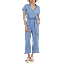 Introducing the Avery Chambray Jumpsuit, a perfect blend of casual chic and practical design. Ideal for a range of occasions, this jumpsuit features: Short Sleeves: Designed with short sleeves for a relaxed and airy feel, perfect for warm weather and easy layering. Surplice Neckline: The flattering surplice neckline adds a touch of elegance, creating a stylish V-neck that enhances your neckline and offers a sophisticated look. Functional Cargo Pockets: Equipped with functional cargo pockets, thi Icon Clothing, Chambray Jumpsuit, Icon Shoes, Cardigan Sweater Coat, Iconic Dresses, Surplice Neckline, Denim Blazer, Cardigan Sweater Dress, Practical Design