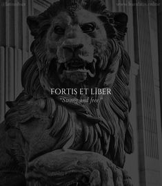 a lion statue with the words forts et liber on it