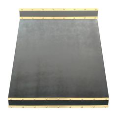 a black and gold metal surface with rivets on the edges, isolated against a white background