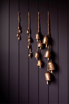 the bells are hanging on the wall and there is no image here to provide a caption for