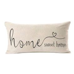 a pillow with the words home sweet home written in cursive font on it