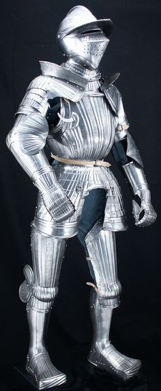 a metal statue of a man dressed in armor