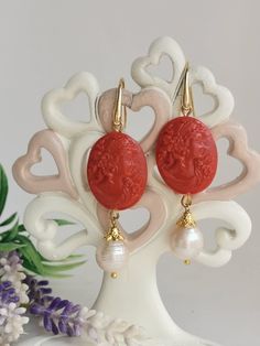 Pendant earrings with cameo in red coral paste imitation handmade in Torre del Greco depicting woman's face 2.5 x 2 cm size, white baroque pearls, monachelle closure in 925 gold-plated silver. total length 6.6 cm. Cameo Earrings For Gift, Red Cameo Jewelry Gift, Red Cameo Jewelry For Wedding, Coral Drop Earrings, Cameo Earrings, Italian Jewelry, Coral Jewelry, 925 Silver Earrings, Rose Earrings