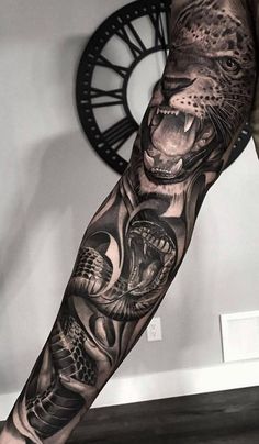 a man's arm with an animal tattoo on it