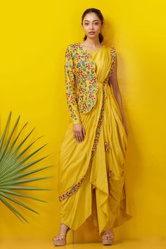 Yellow cowl draped dress with floral embroidered border. Paired with one sided scallop hem floral embroidered jacket.
Component: 2
Embroidered
Neckine: Round
Sleeve Length: Sleeveless
Fabric: Silk Cotton
Color: Yellow
Side tassel tie-up
Closure: Side zip
 - Aza Fashions Yellow Haldi Outfit, Cowl Drape Dress, Drape Sari, Indo Western Outfits For Women, Haldi Dress, Haldi Outfits, Haldi Outfit, Draping Fashion, Cowl Dress