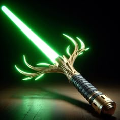 a green light saber on a wooden table with the lights turned off and glowing in the dark