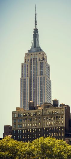 the empire building towering over new york city