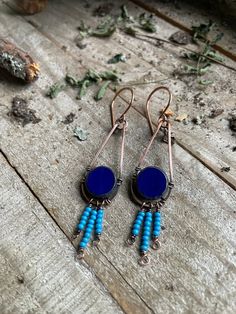 These earrings are made with copper wire frames with a blue bead and turquoise blue seed beads at the bottom. They approximately measure 3 inches.  I'm an artist based in South Carolina .I've been creating and selling for about 10 years ,I get a lot of my inspiration from variety of cultures and nature. If you have any questions please feel free to ask. Thank you for visiting!! Copper Wire Earrings, Jewelry Colorful, Jewelry Wire, Bleu Turquoise, Colorful Jewelry, Wire Earrings, Copper Earrings, Bead Earrings, Blue Beads