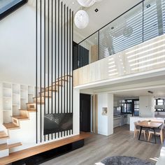 a living room filled with furniture and a flat screen tv