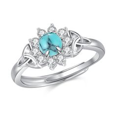 a white gold ring with turquoise stone and diamonds