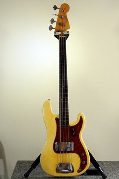 a yellow guitar sitting on top of a table