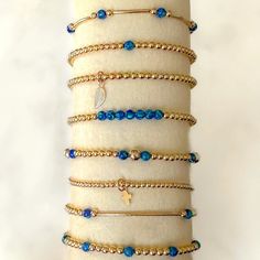 Gold Bracelet: Blue Lapis and Gold Bracelet Stack Our "Gorgeous Galaxy" Blue Lapis and Gold Bracelet Stack brings a touch of sophistication to an everyday jewelry staple. The Gold Bracelet, a timeless piece of jewelry, are crafted with the highest attention to detail, and the blue lapis stones add a unique element, enhancing the gold's rich hue. PURCHASE OPTIONS Can be purchased individually - individual bracelets are numbered in photos OR You can purchase them as a stack set. If you do, you wil Gold Bracelet Stack, Gold Bracelets Stacked, Jewelry Staples, Fun Bracelet, Gold Bracelets, Bracelet Blue, Initial Bracelet, Blue Lapis, Silver Bangle Bracelets